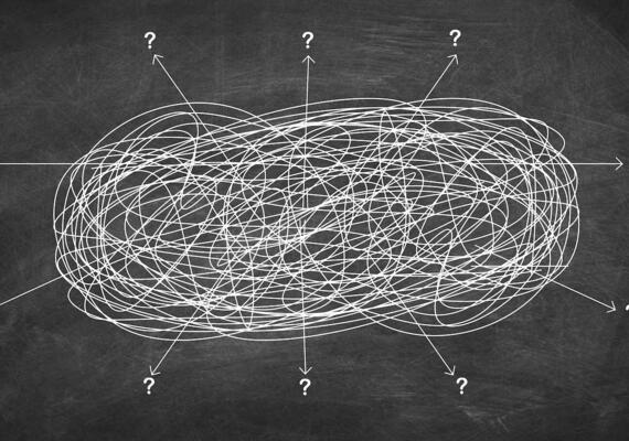 A confusing jumble of intersecting lines on a chalkboard